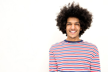 smiling young african american man with afro hair against isolated white background