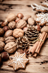 cinnamon sticks and coffee beans on wooden background