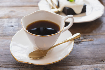 cup of coffee on wooden table