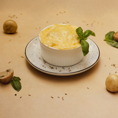casserole with a cheese close up on a table on a rustic kitchen. Concept helphy food