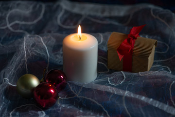 White candle and Christmas decorations