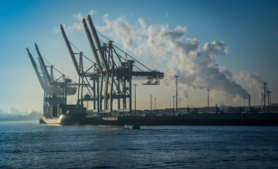 Early morning in the industrial harbour of Hamburg.