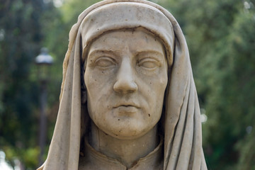 Old marble bust of Giotto in the public park Pincian Hill, Villa Borghese gardens, Rome, Italy