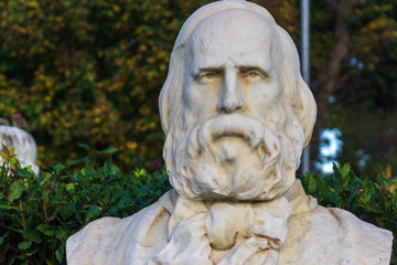 Old marble bust of Giuseppe Garibaldi in the public park Pincian Hill, Villa Borghese gardens, Rome, Italy