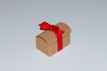 Small vintage gift box with red ribbon bow