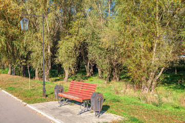 bench and street lamp in the urban park 