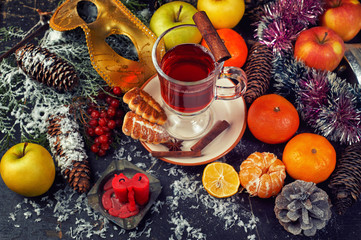 A Cup of hot mulled wine, a traditional drink for winter time. Christmas composition