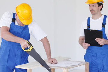 Two workmen at construction site