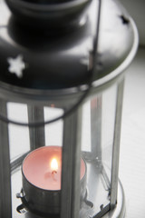 tea candle in metal latern