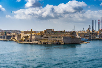 Fototapeta na wymiar A large cloud over Fort St Angelo, Birgu, Malta.