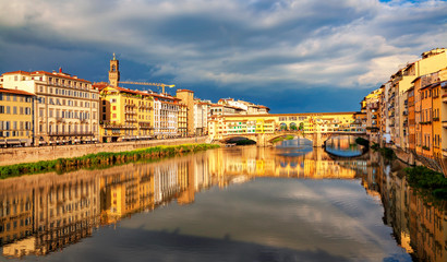 Fototapeta na wymiar View of medieval stone bridge Ponte Vecchio over Arno river in Florence, Tuscany, Italy. Beautiful Florence after the rain. Florence architecture and landmark.