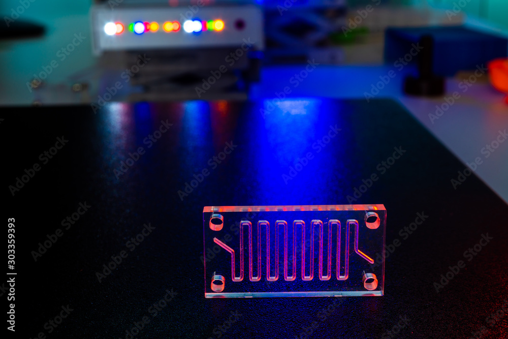 Sticker Organ-on-a-chip (OOC) - microfluidic device chip that simulates biological organs that is type of artificial organ. Prototype of design lab-on-a-chip in microfluidic laboratory