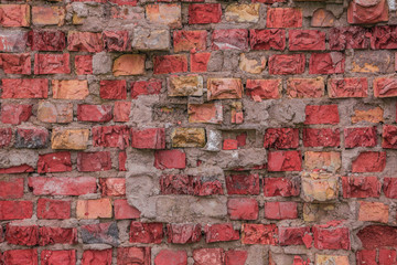 Background of broken brick in different colors, masonry across