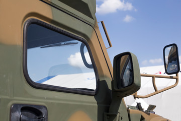 Fototapeta na wymiar Side window of military vehicle