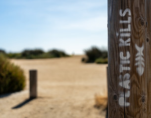 plastic kills fish writing on beach in southern france