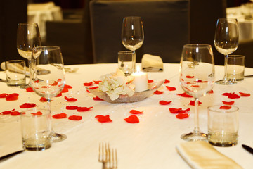 warm banquet hall decorated with rose petals