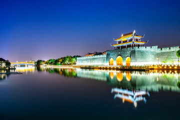 Fototapeta premium Night view of ancient city wall of pingmen, Suzhou..
