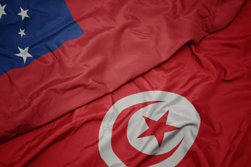 waving colorful flag of tunisia and national flag of Samoa .
