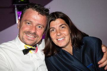 Head shot fun portrait of smiling couple sitting in party cafe together event