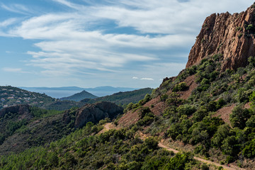 Fototapeta na wymiar cap roux hiking trail In the red rocks of the Esterel mountains with the blue sea of the Mediterranean