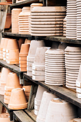 Stacks of orange and grey terracotta pots