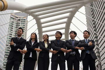 Fototapeta premium Business team shake hands in city