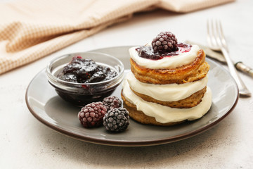 Pancakes with berry and jam. homemade, vegan pancakes with cream and fruit jam.