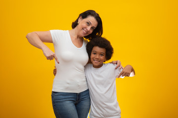 White mother with black son. Adoption Concept. Social respect, skin color, inclusion.