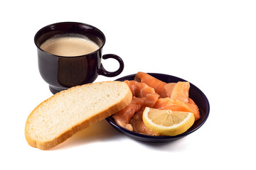  Slices of red salmon fish in a black plate, a cup of cappuccino coffee and a slice of bread on a white background