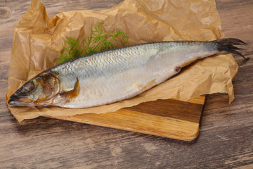 Salted herring over the wooden board