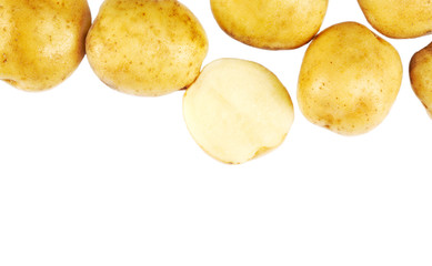 Raw potatoes on white background. Vegetables abstract background, copy space