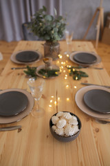 Christmas table in the kitchen with a festive Christmas tree decorated.
