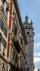 old church tower photographed in the streets of genua, italy