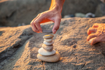 man hand put stone building