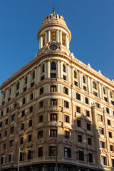 Fototapeta na wymiar Sunset view of Building at Gran Vía street in City of Madrid