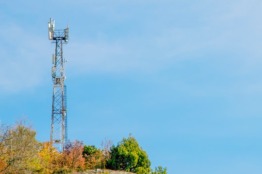 tower with mobile operator antennas  on the background sky