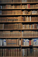 old books on wooden shelf