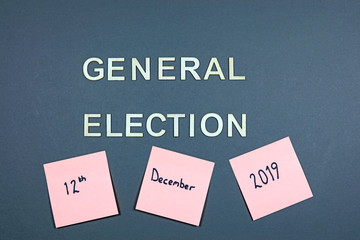 Wooden Letters On A Plain Background Spelling Out The Words General Election With Date On Sticky Notes.