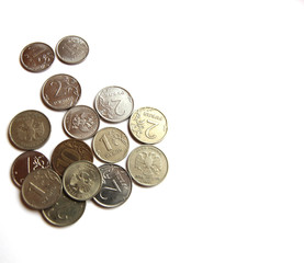 Several Russian coins lie on a white isolated background. Shiny Russian metal money.