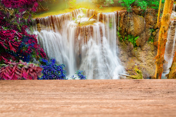 Wood table top on beautiful waterfall background