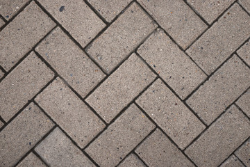 The texture of the grey paving slabs