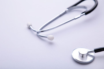 Medical stethoscope on a grey background. Health care concept