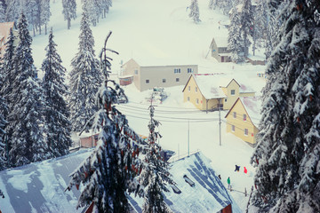 Beautiful white winter wonderland mountain scenery in the Carpathian with traditional house.