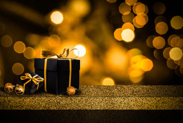 Shelf and podium with realistic black gifts boxes with gold bows. Dark background golden text lettering. Horizontal banner, poster, header website