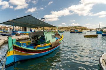 Fototapeta na wymiar view of the harbor with boats, of marsaxlokk on malta