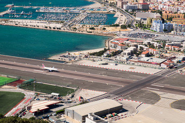 Gibraltar airport runway and La Linea de la Concepcion in Spain. View from the top of the rock of Gibraltar.