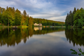 Fototapeta na wymiar Ebnisee Lake Long exposure Forest Landscape House