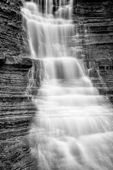 Fototapeta na wymiar The hidden waterfall, black and white photography