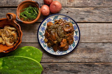 Mexican rosemary with mole sauce and dried shrimps also called 
