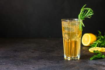 lemonade ice in a glass with rosemary (tasty drink, beverage) menu concept. food background. top...